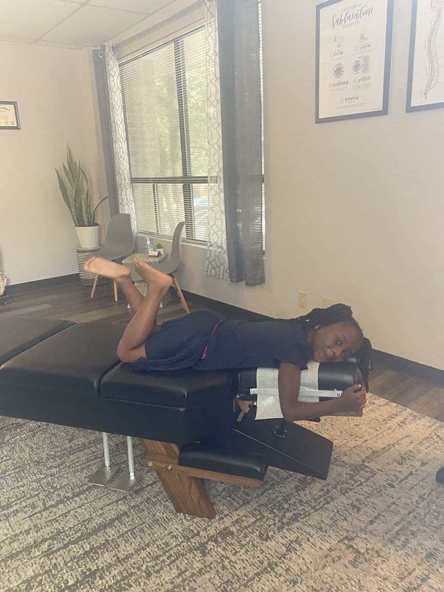 A patient resting on the table in the clinic's bright front room